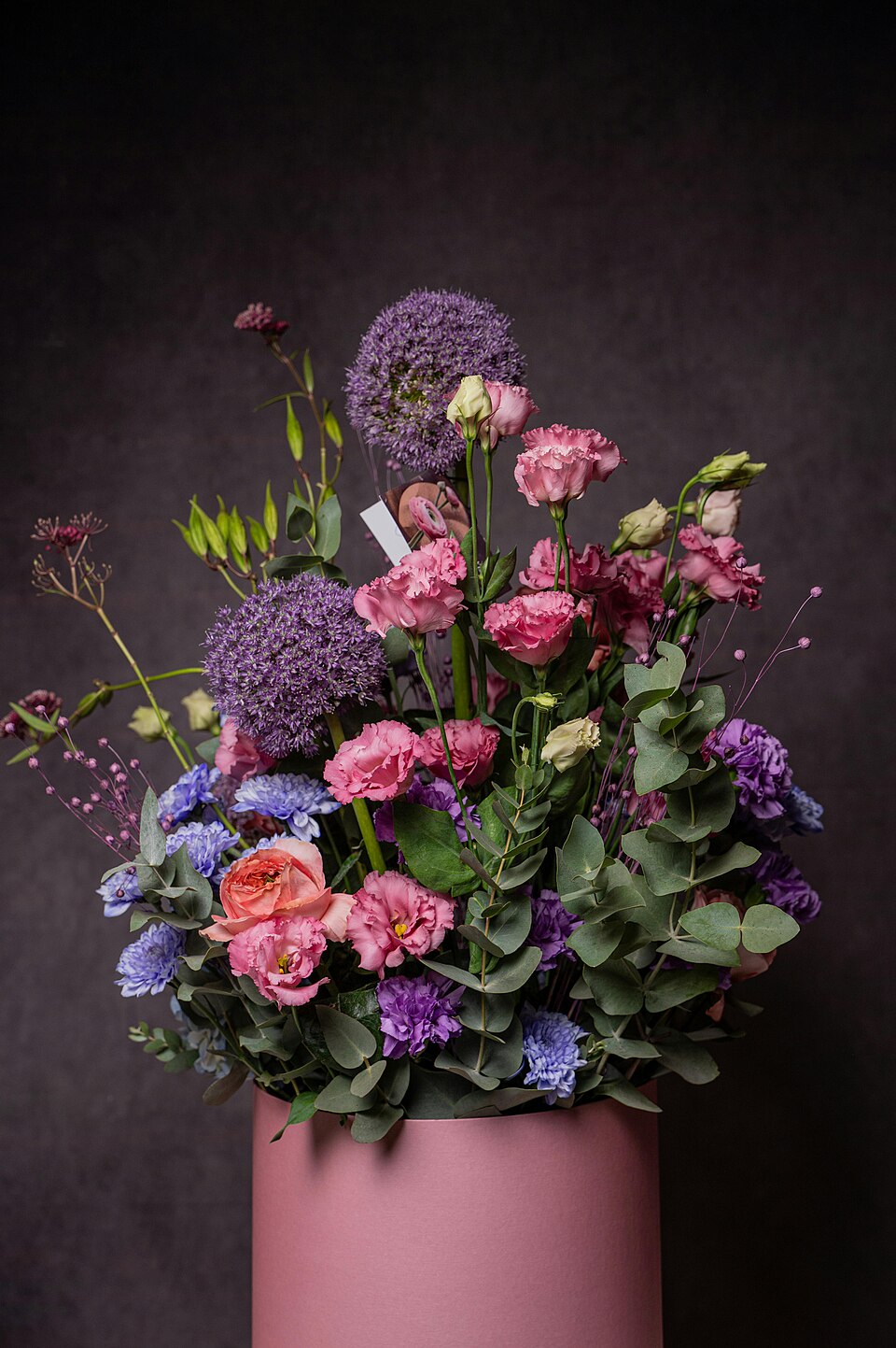 Floral arrangement in pink and violet tones